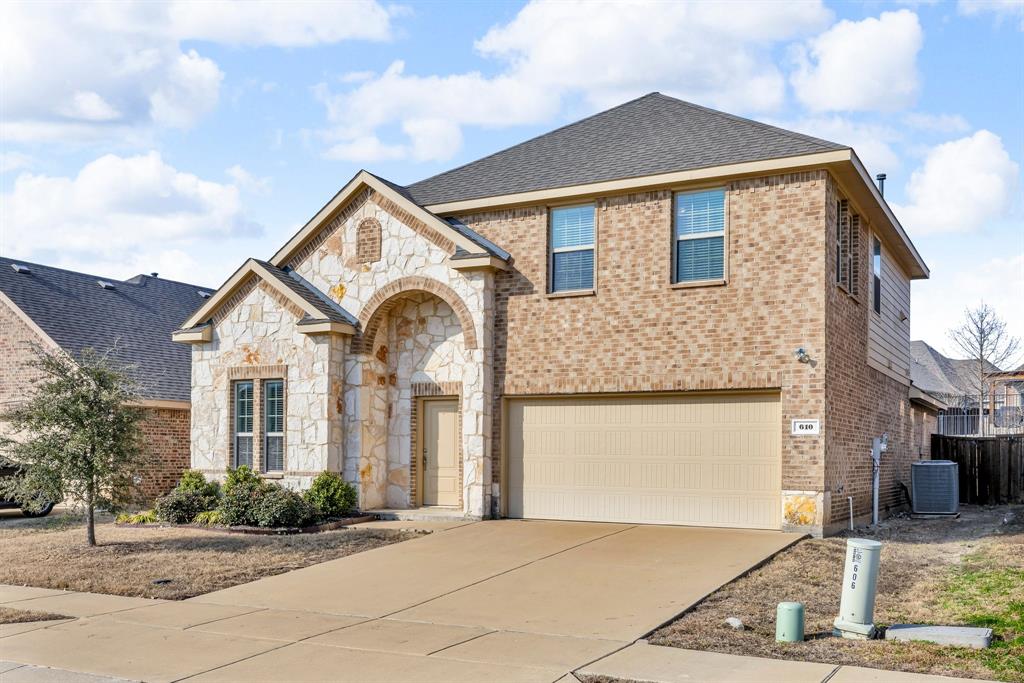 610 Bassett Hall Road Fate, TX 75189 - Photo 2 of 28 View of front facade with a garage and central AC unit
