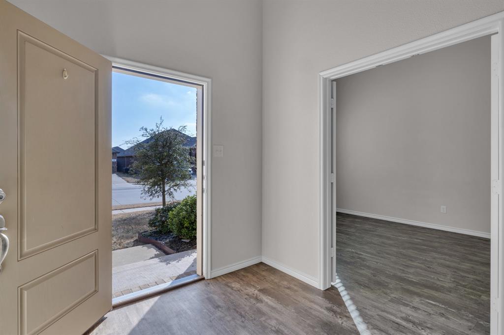 610 Bassett Hall Road Fate, TX 75189 - Photo 4 of 28 Foyer entrance featuring hardwood / wood-style floors