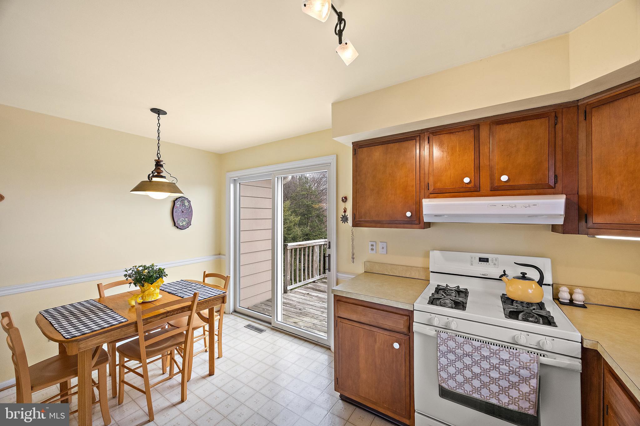 509 Holly Knoll Road Hockessin, DE 19707 - Photo 12 of 34 a kitchen that has a table and chairs in it