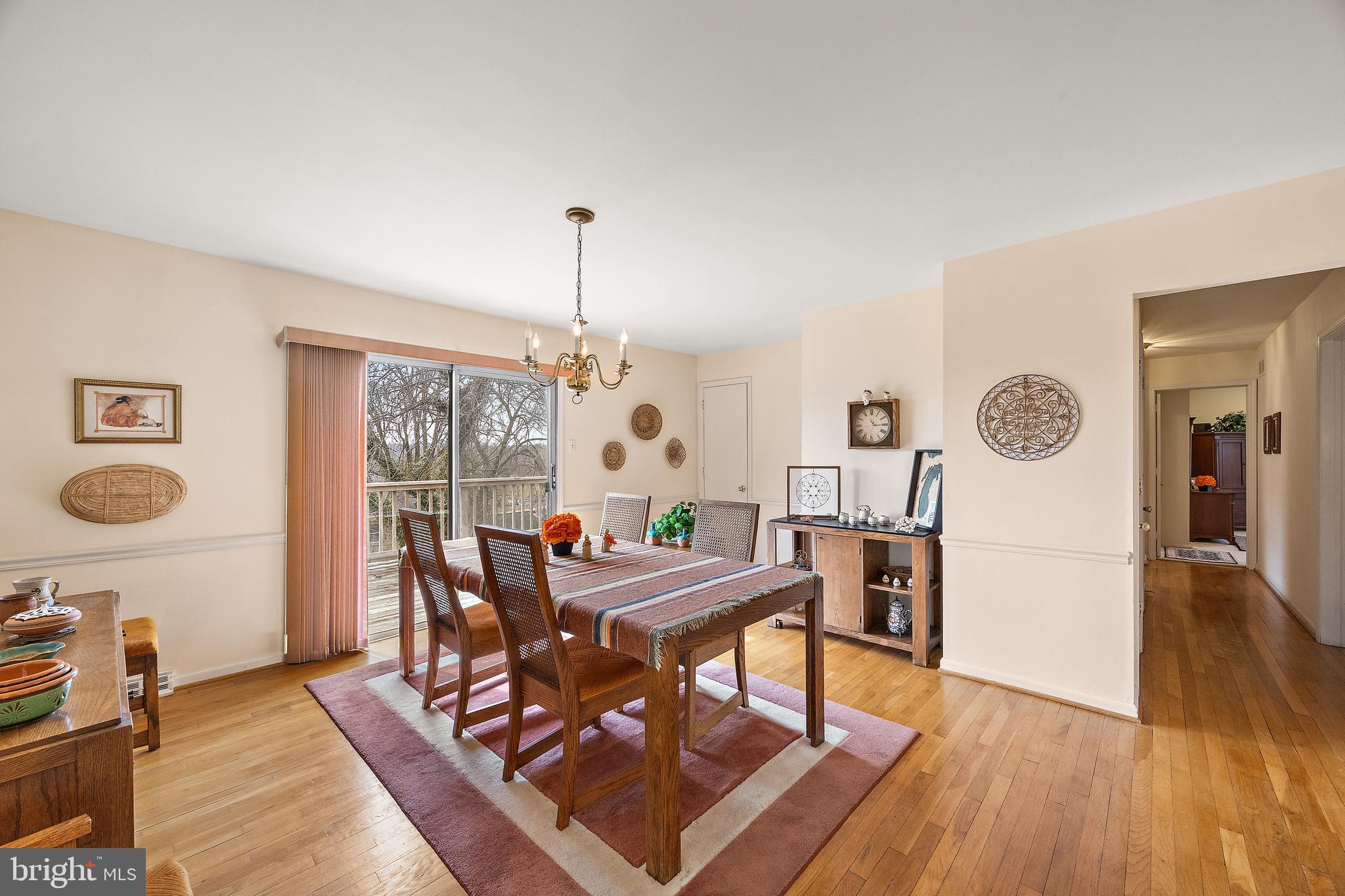 509 Holly Knoll Road Hockessin, DE 19707 - Photo 13 of 34 a view of a dining room with furniture and wooden floor
