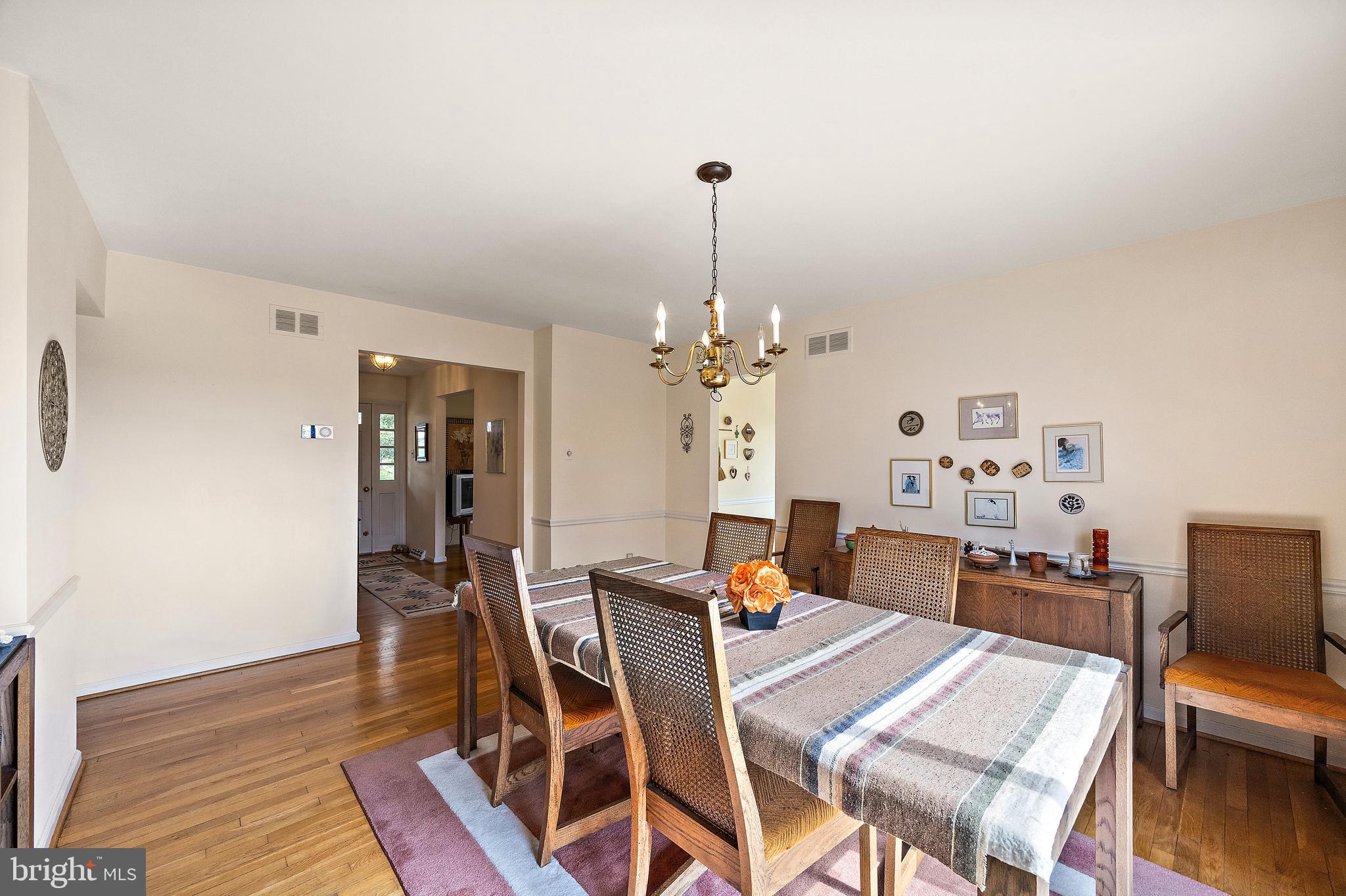 509 Holly Knoll Road Hockessin, DE 19707 - Photo 16 of 34 a view of a dining room with furniture and wooden floor