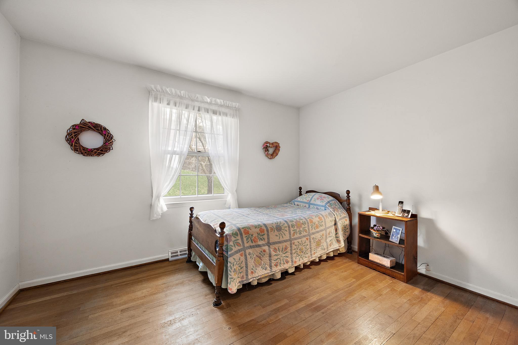 509 Holly Knoll Road Hockessin, DE 19707 - Photo 17 of 34 a bedroom with a bed and a window