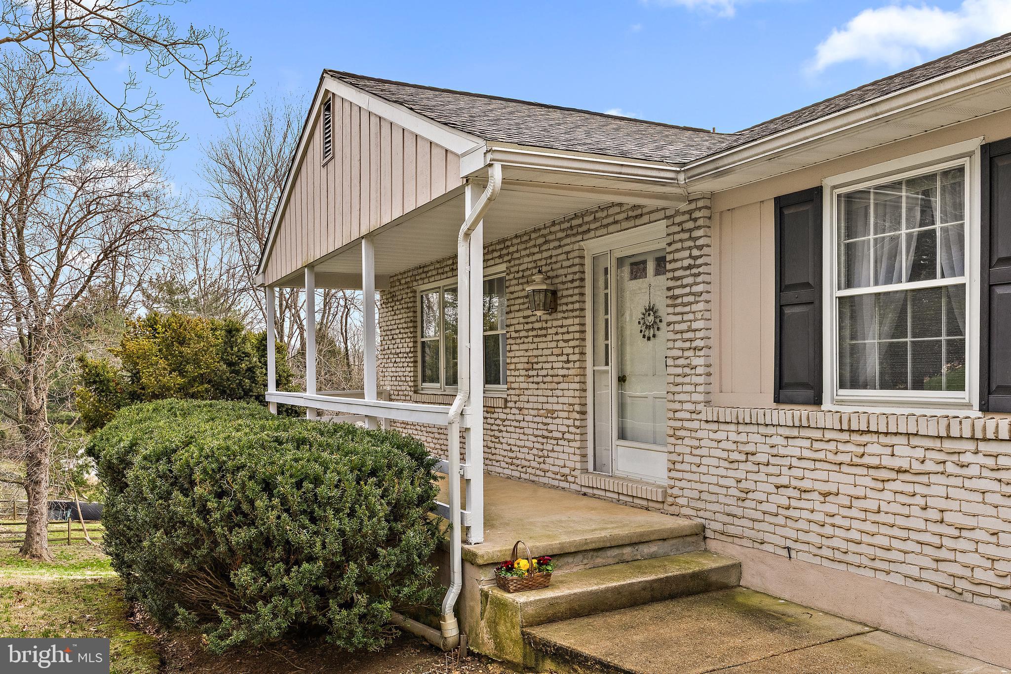 509 Holly Knoll Road Hockessin, DE 19707 - Photo 2 of 34 a front view of a house with a yard