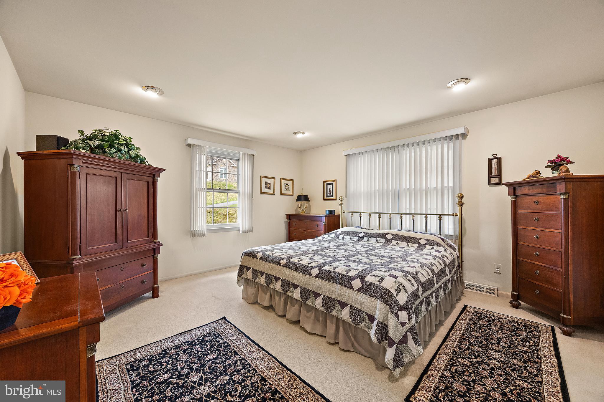 509 Holly Knoll Road Hockessin, DE 19707 - Photo 22 of 34 a bedroom with a bed and wooden floor