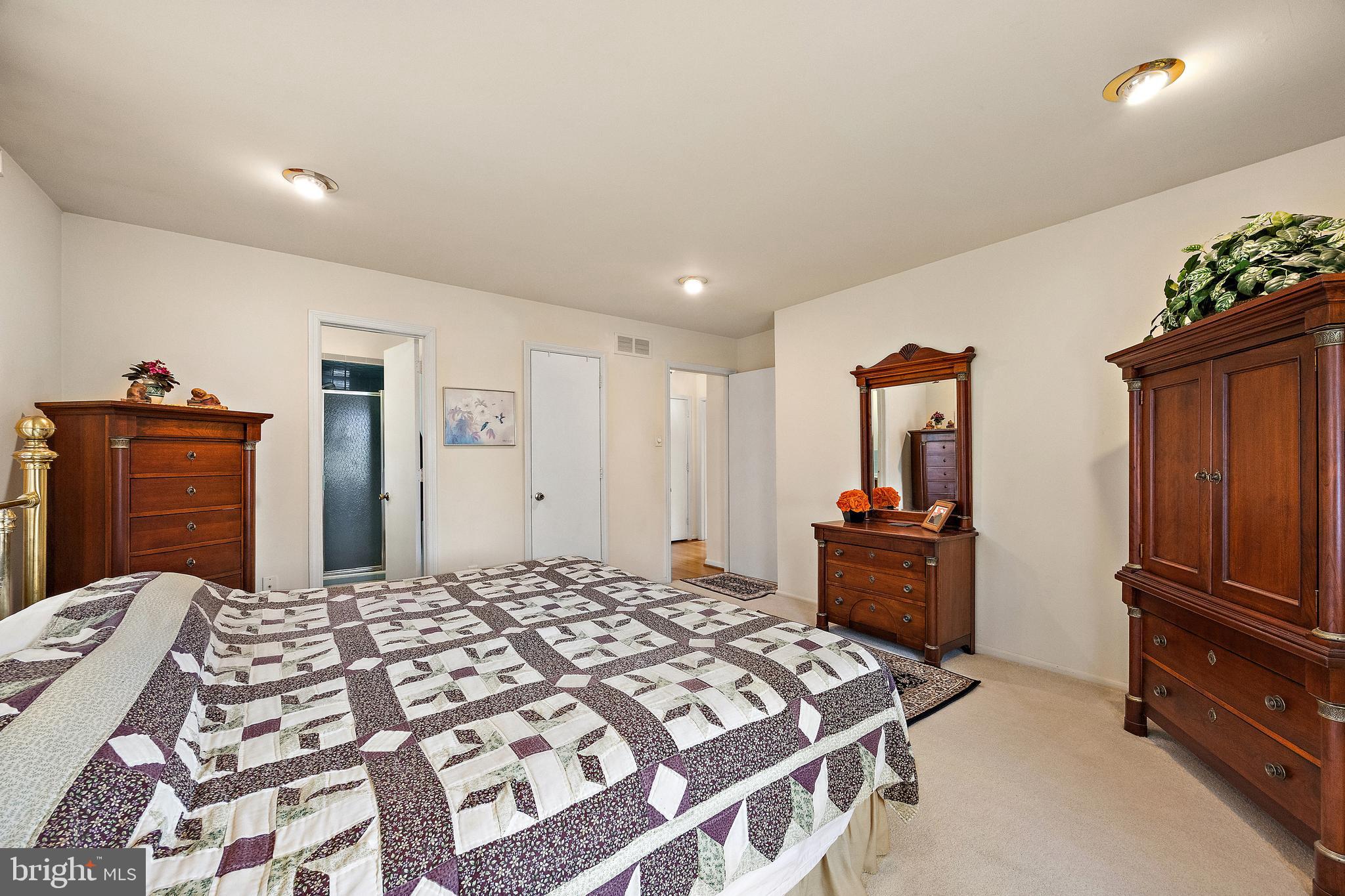 509 Holly Knoll Road Hockessin, DE 19707 - Photo 23 of 34 a bedroom with a bed and a dresser