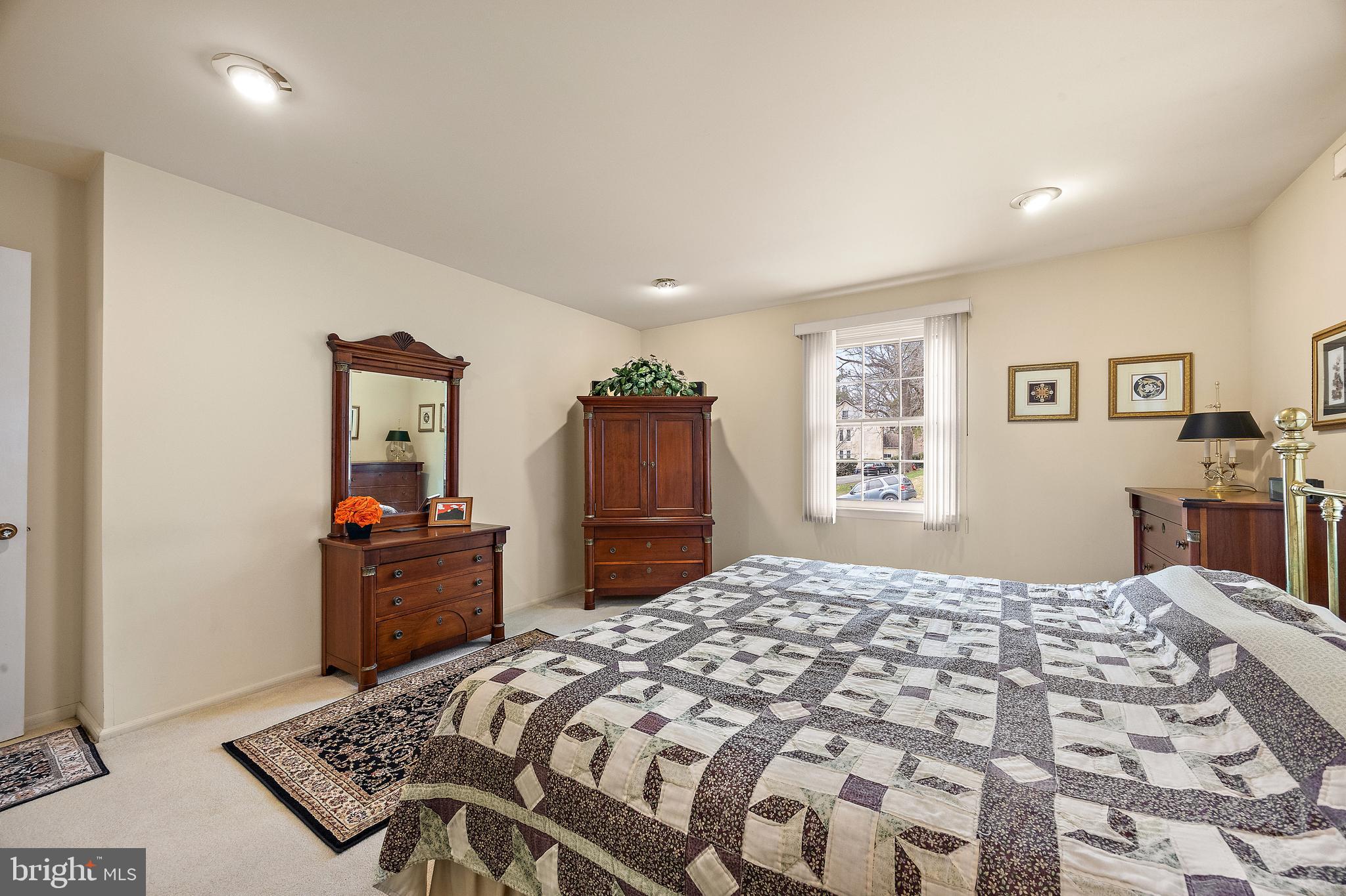 509 Holly Knoll Road Hockessin, DE 19707 - Photo 24 of 34 a bedroom with a bed and a dresser in it