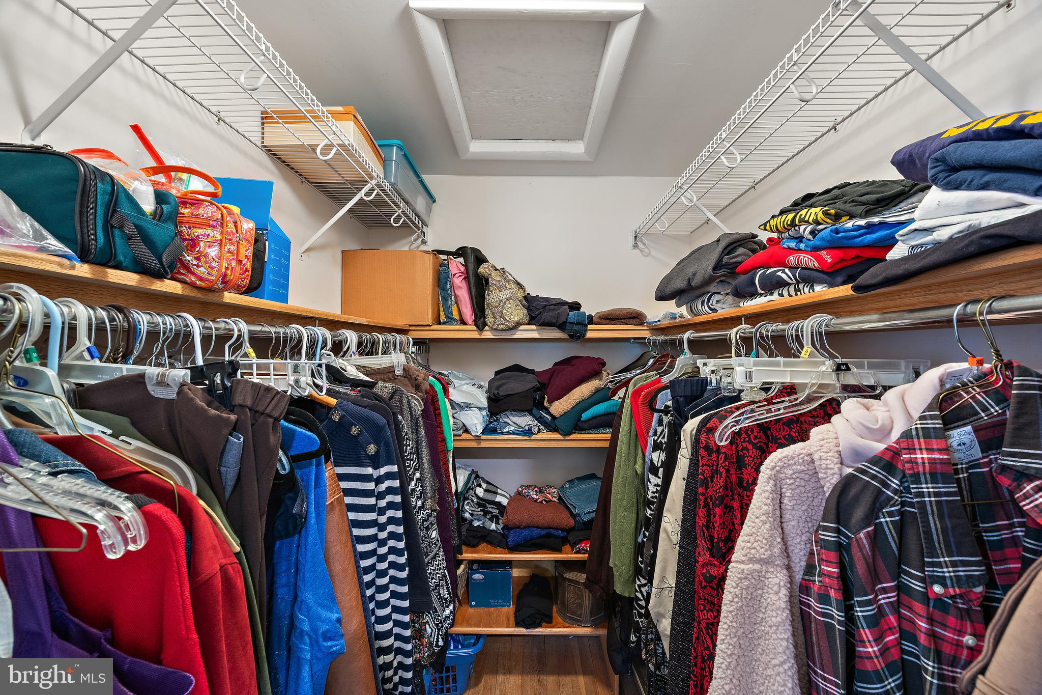 509 Holly Knoll Road Hockessin, DE 19707 - Photo 26 of 34 a view of walk in closet with clothes and shoes