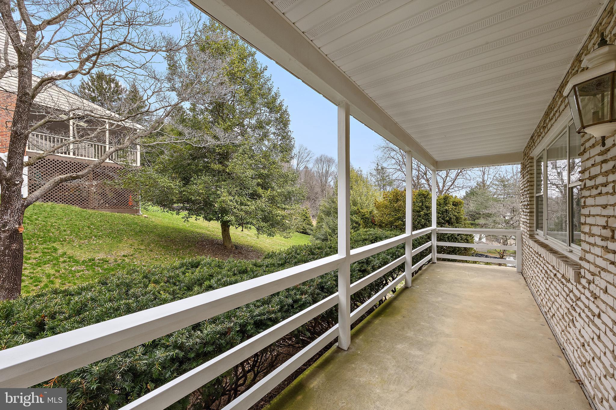 509 Holly Knoll Road Hockessin, DE 19707 - Photo 3 of 34 a view of a porch with wooden floor and fence