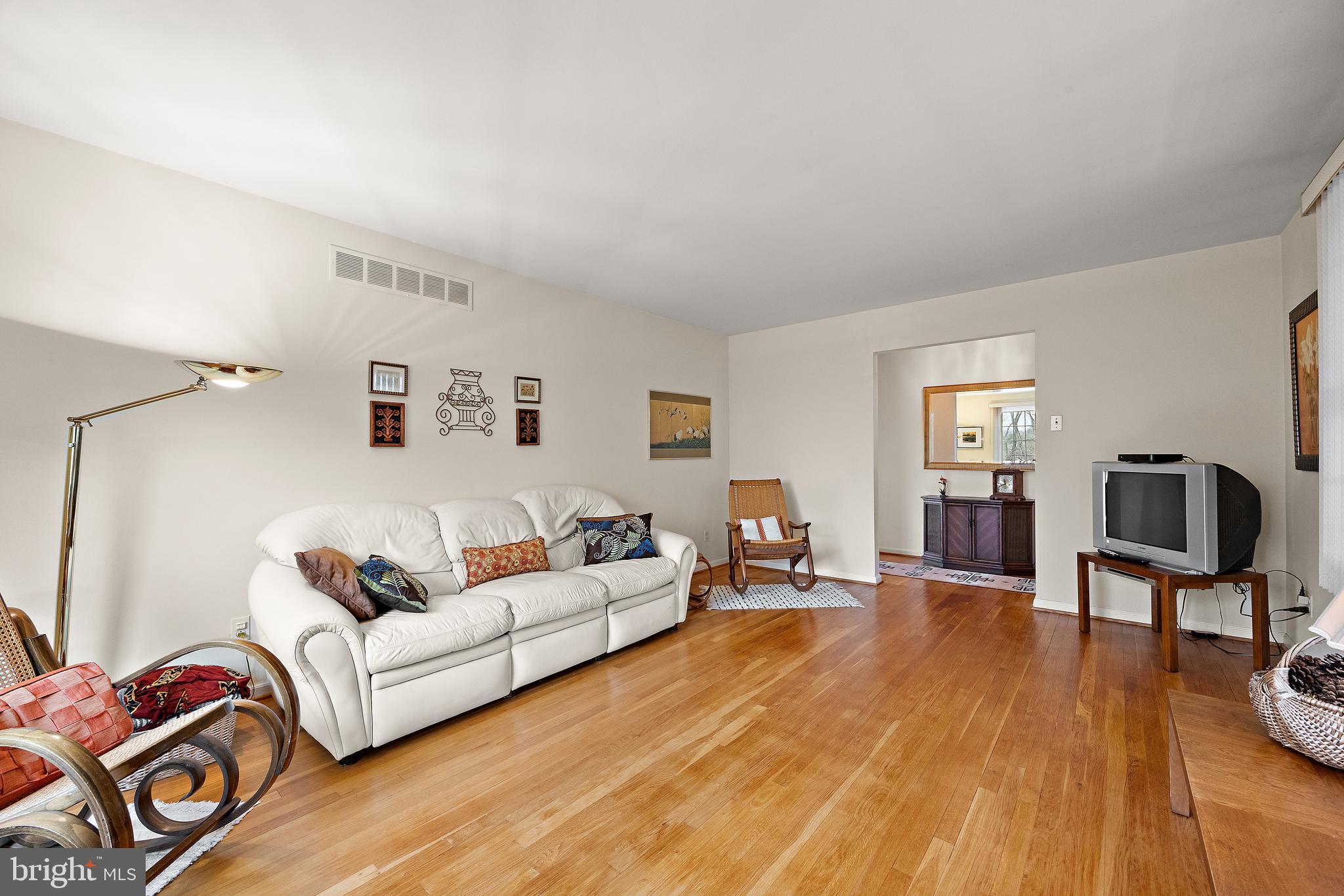 509 Holly Knoll Road Hockessin, DE 19707 - Photo 6 of 34 a living room with furniture and a wooden floor