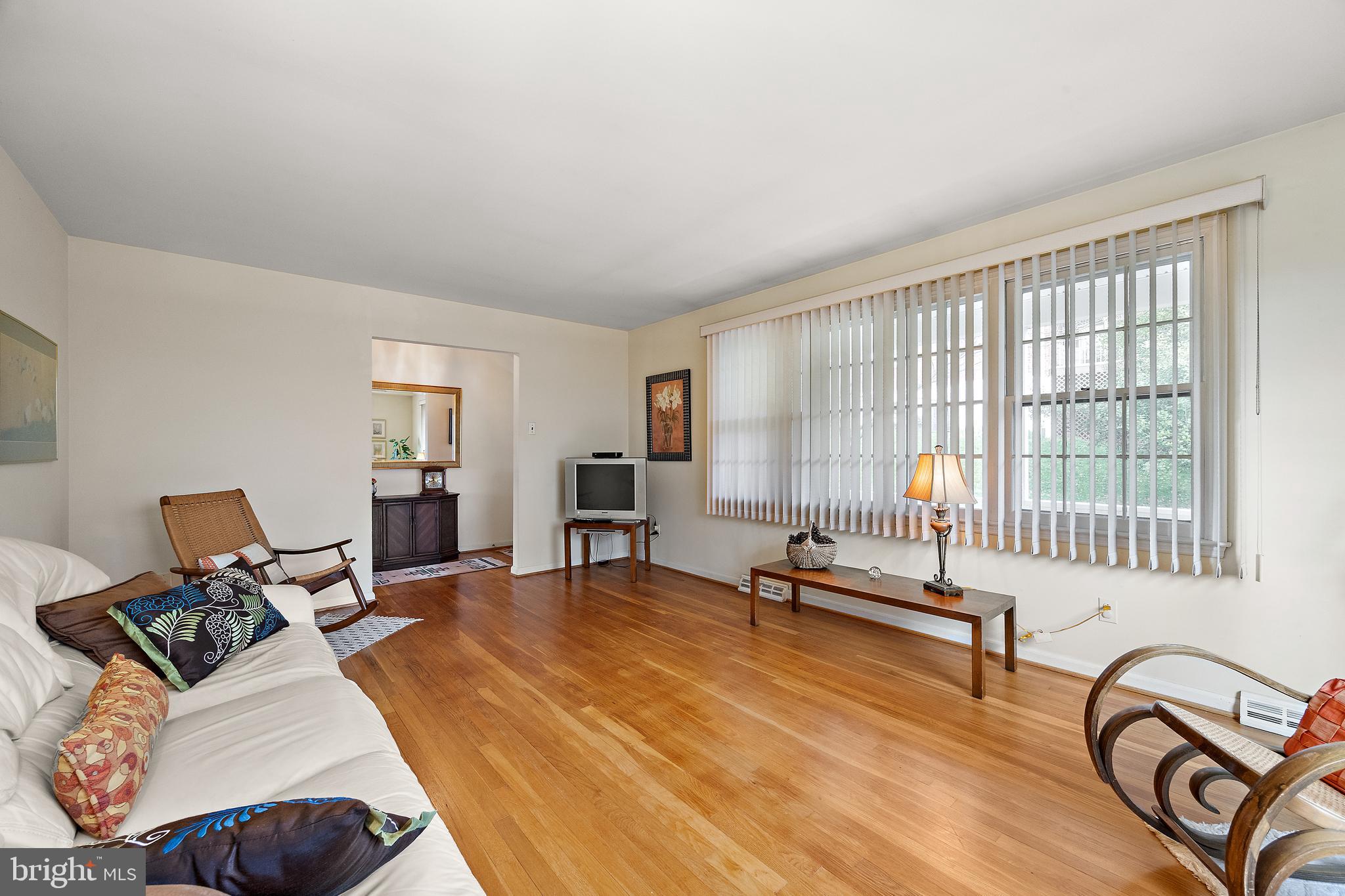 509 Holly Knoll Road Hockessin, DE 19707 - Photo 7 of 34 a living room with furniture and floor to ceiling window