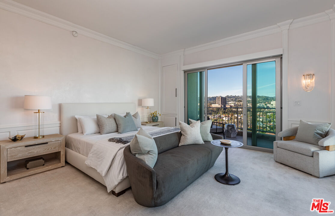 10727 Wilshire Boulevard, Unit 1702 Los Angeles, CA 90024 - Photo 13 of 43 a living room with furniture and a large window