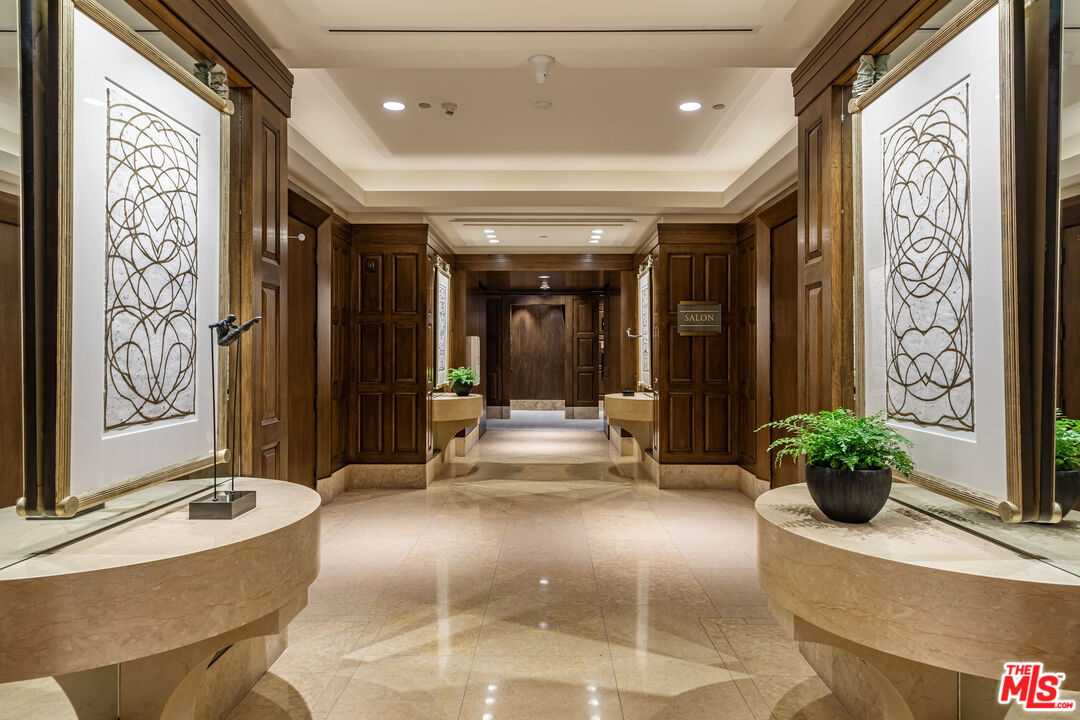 10727 Wilshire Boulevard, Unit 1702 Los Angeles, CA 90024 - Photo 26 of 43 a lobby with furniture and a potted plant