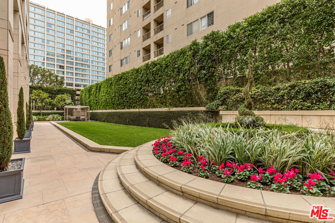 10727 Wilshire Boulevard, Unit 1702 Los Angeles, CA 90024 - Photo 30 of 43 a view of a garden with flowers and trees