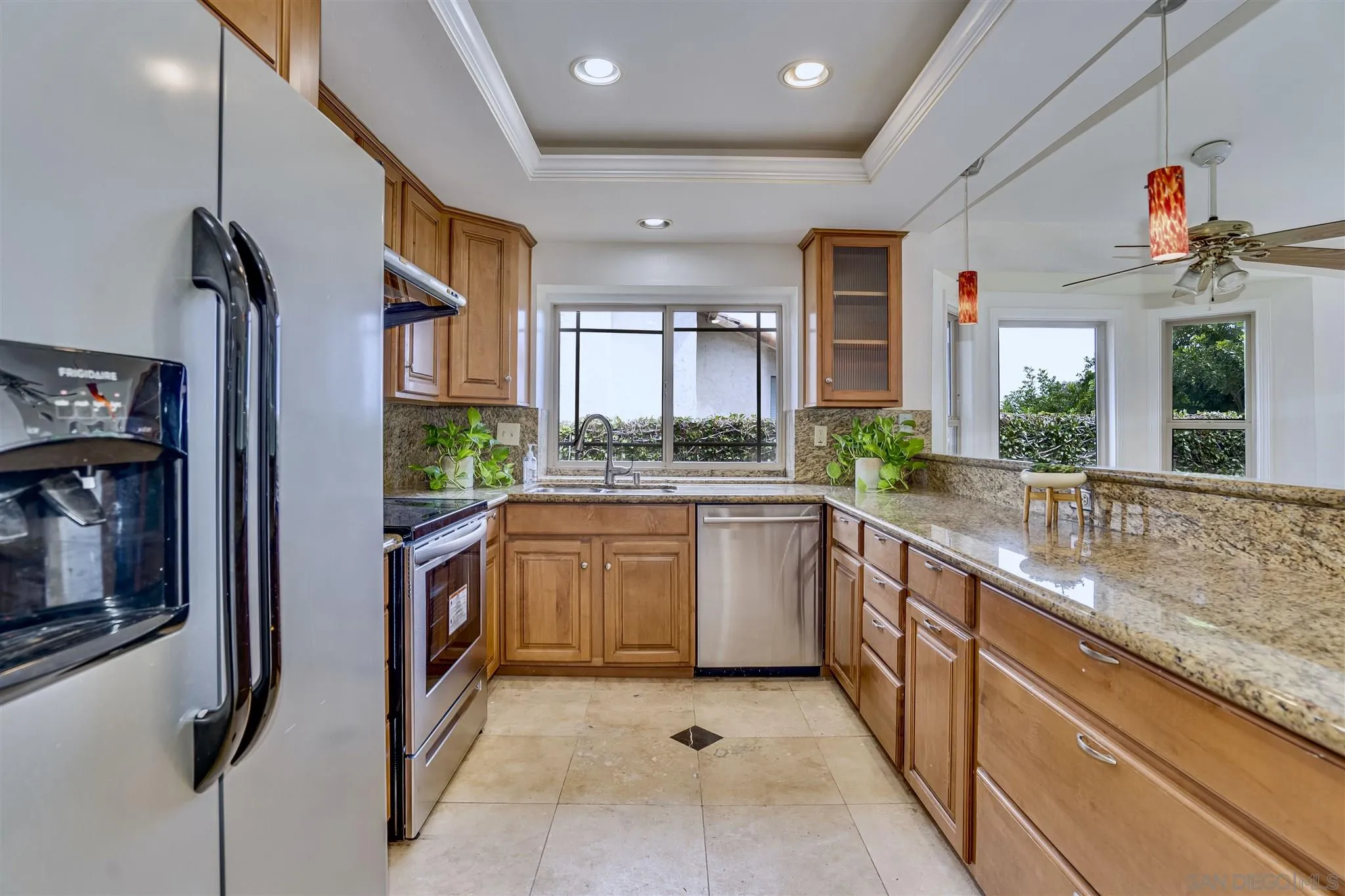 1975 Avenida La Posta Encinitas, CA 92024 - Photo 15 of 29 a kitchen with stainless steel appliances granite countertop a refrigerator and a sink