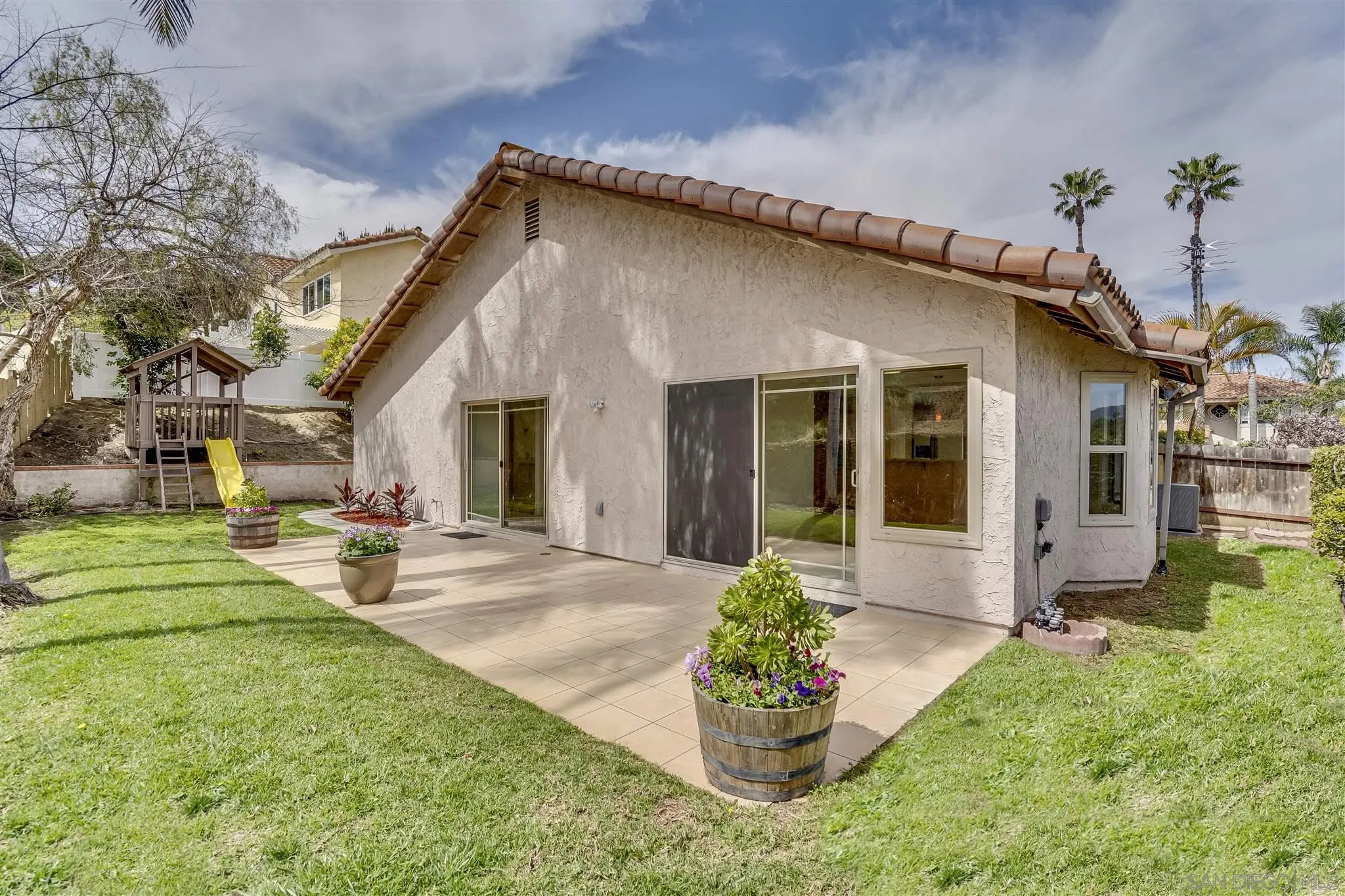 1975 Avenida La Posta Encinitas, CA 92024 - Photo 20 of 29 a front view of a house with garden