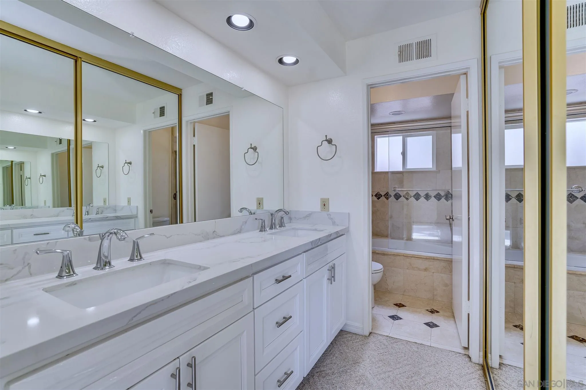 1975 Avenida La Posta Encinitas, CA 92024 - Photo 24 of 29 a bathroom with a granite countertop sink mirror and double