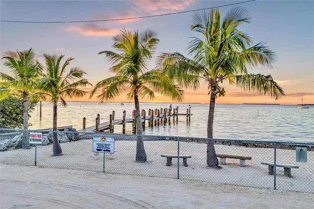 a view of a backyard with a table and chair