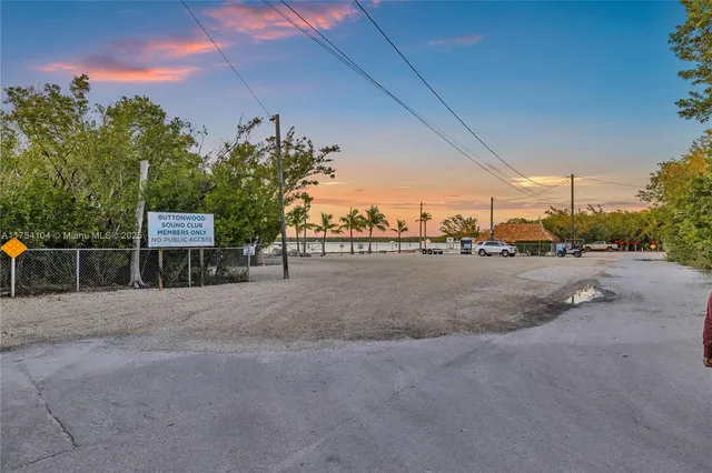 a kitchen with stainless steel appliances granite countertop a stove a sink a refrigerator and a microwave