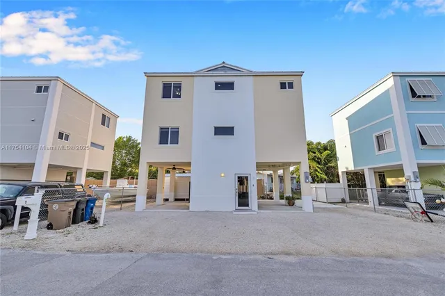 a kitchen with stainless steel appliances granite countertop a sink and cabinets with wooden floor