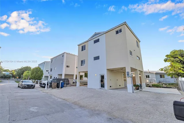 a spacious bathroom with a double vanity sink and a mirror