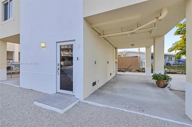 a workspace with wooden floor and a window