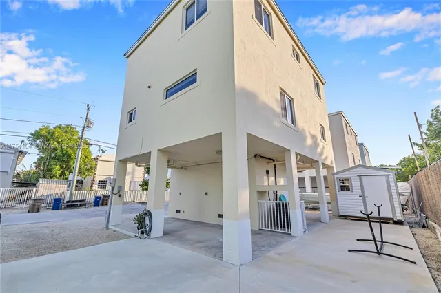 a spacious bathroom with a granite countertop sink and a mirror