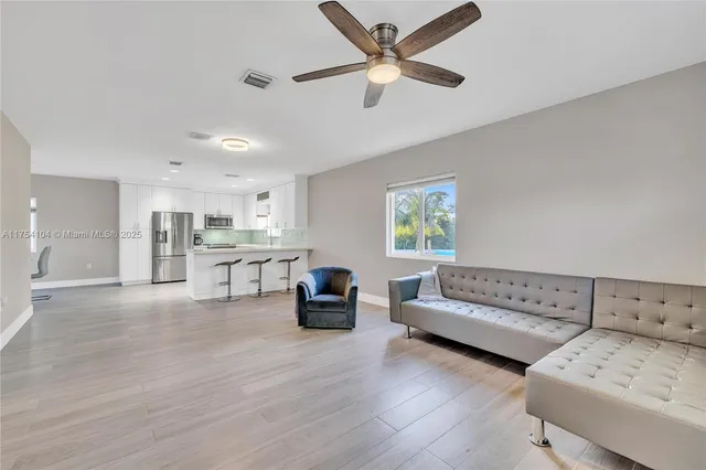 a en suite bathroom with a double vanity sink and a mirror