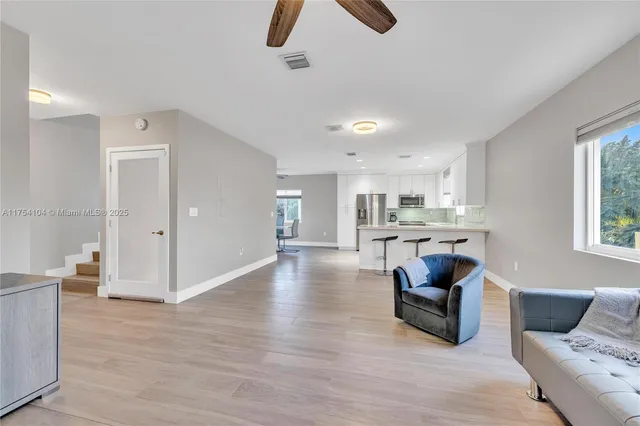 a bathroom with a sink toilet vanity and shower