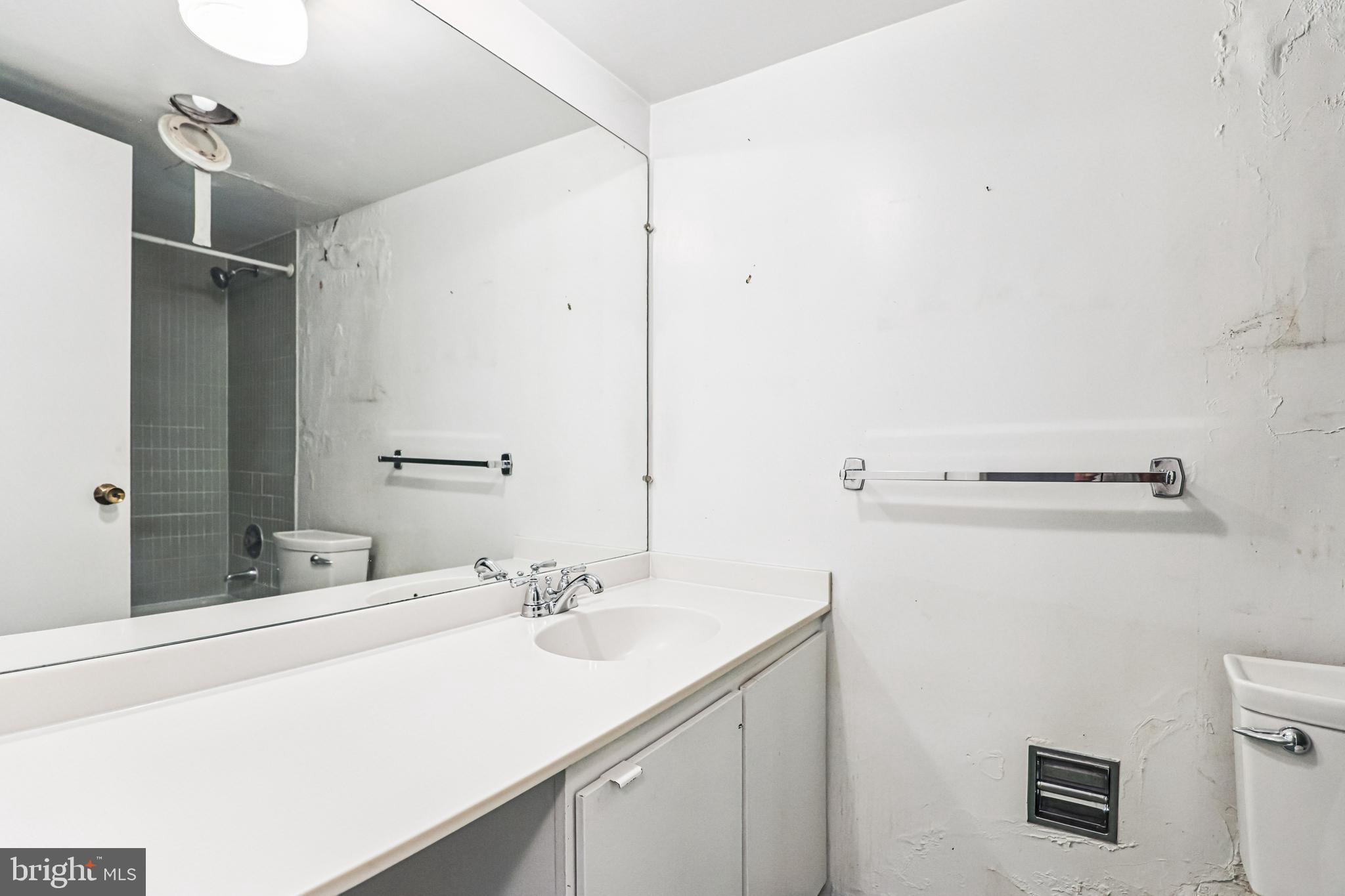 2500 Virginia Avenue Northwest, Unit 210S Washington, DC 20037 - Photo 10 of 25 a bathroom with a sink and a mirror