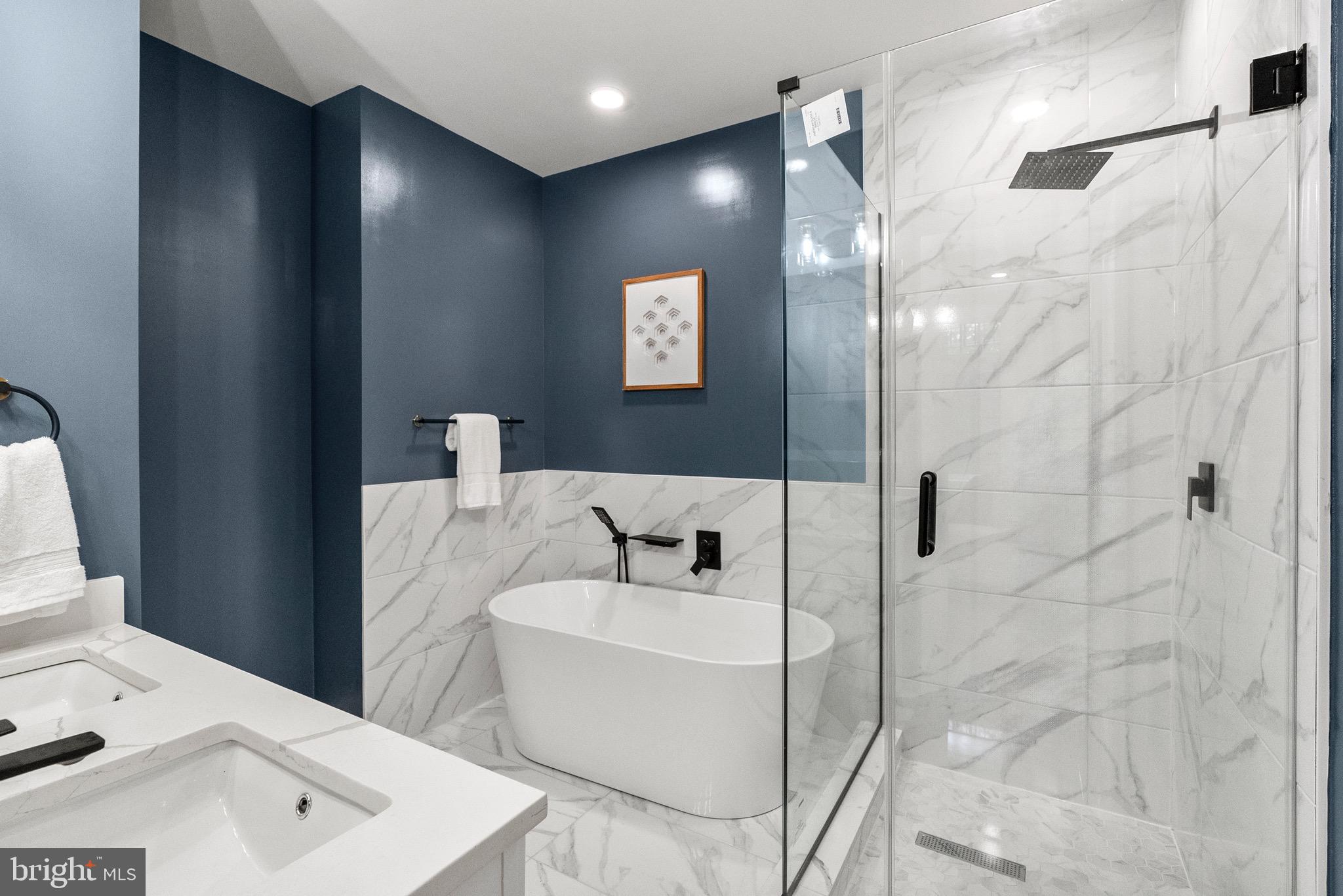 2019 M Street Northeast, Unit 1 Washington, DC 20002 - Photo 22 of 31 a bathroom with a bathtub and shower