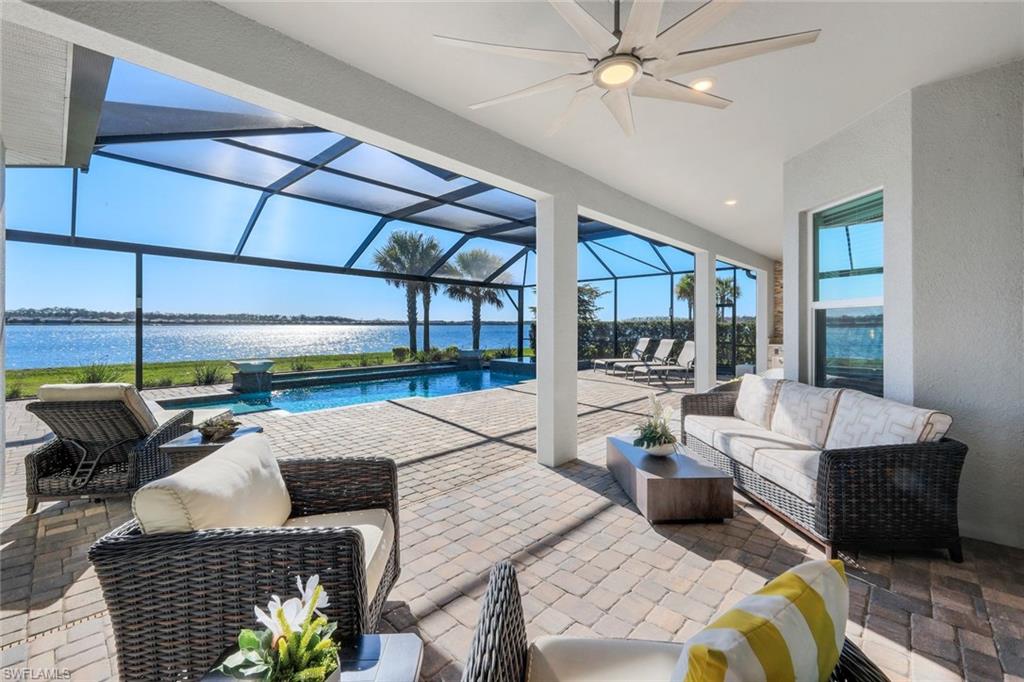 14630 Blue Bay Circle Fort Myers, FL 33913 - Photo 15 of 43 a living room with lots of furniture and a chandelier