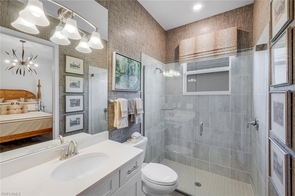 14630 Blue Bay Circle Fort Myers, FL 33913 - Photo 19 of 43 a bathroom with a sink a toilet and shower