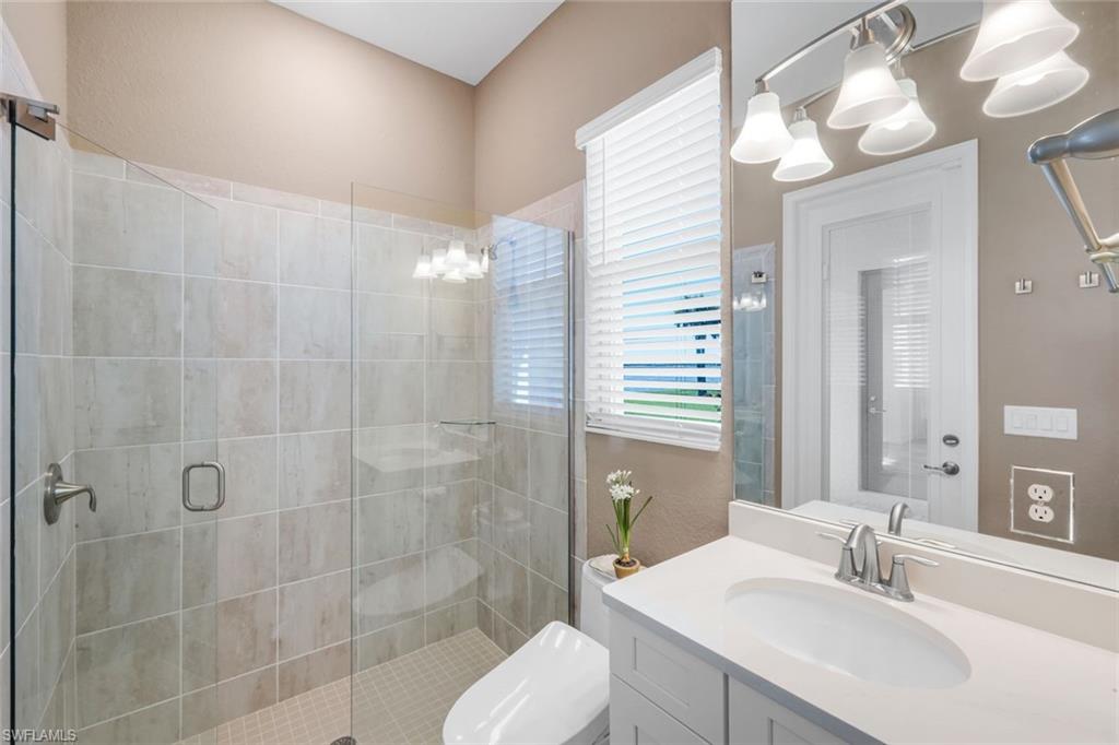 14630 Blue Bay Circle Fort Myers, FL 33913 - Photo 21 of 43 a bathroom with a sink toilet and shower