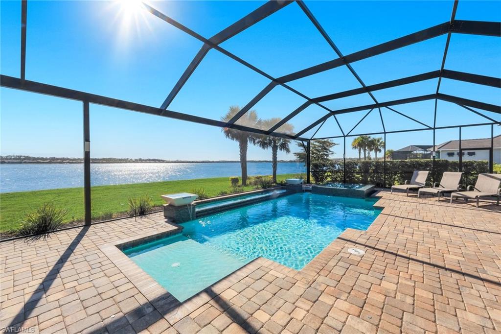14630 Blue Bay Circle Fort Myers, FL 33913 - Photo 28 of 43 a view of a swimming pool with a lounge chairs