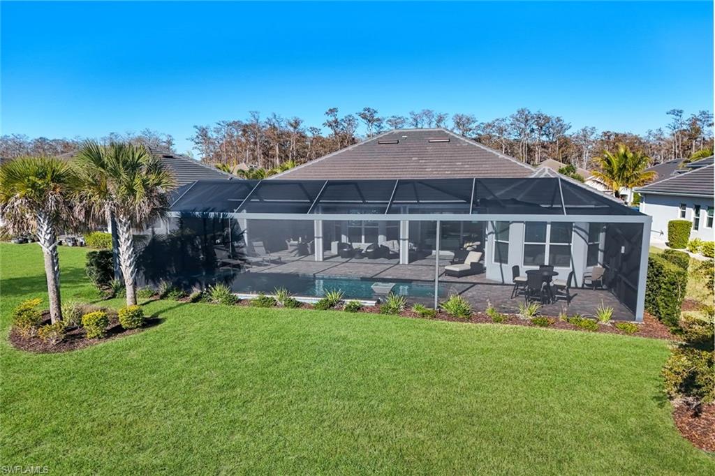 14630 Blue Bay Circle Fort Myers, FL 33913 - Photo 5 of 43 a view of a house with a yard porch and sitting area