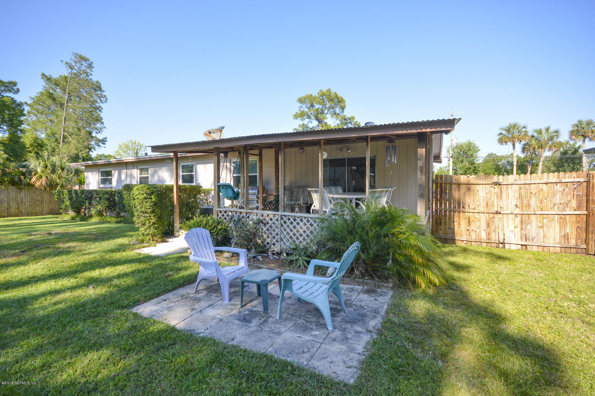 2104 Dean Road Jacksonville, FL 32216 - Photo 2 of 20 a view of a house with backyard sitting area and garden