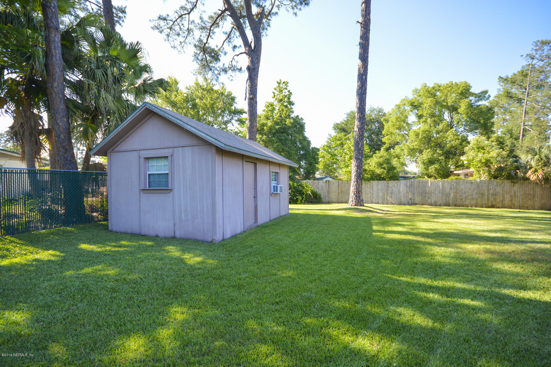 2104 Dean Road Jacksonville, FL 32216 - Photo 5 of 20 a view of backyard of house with green space