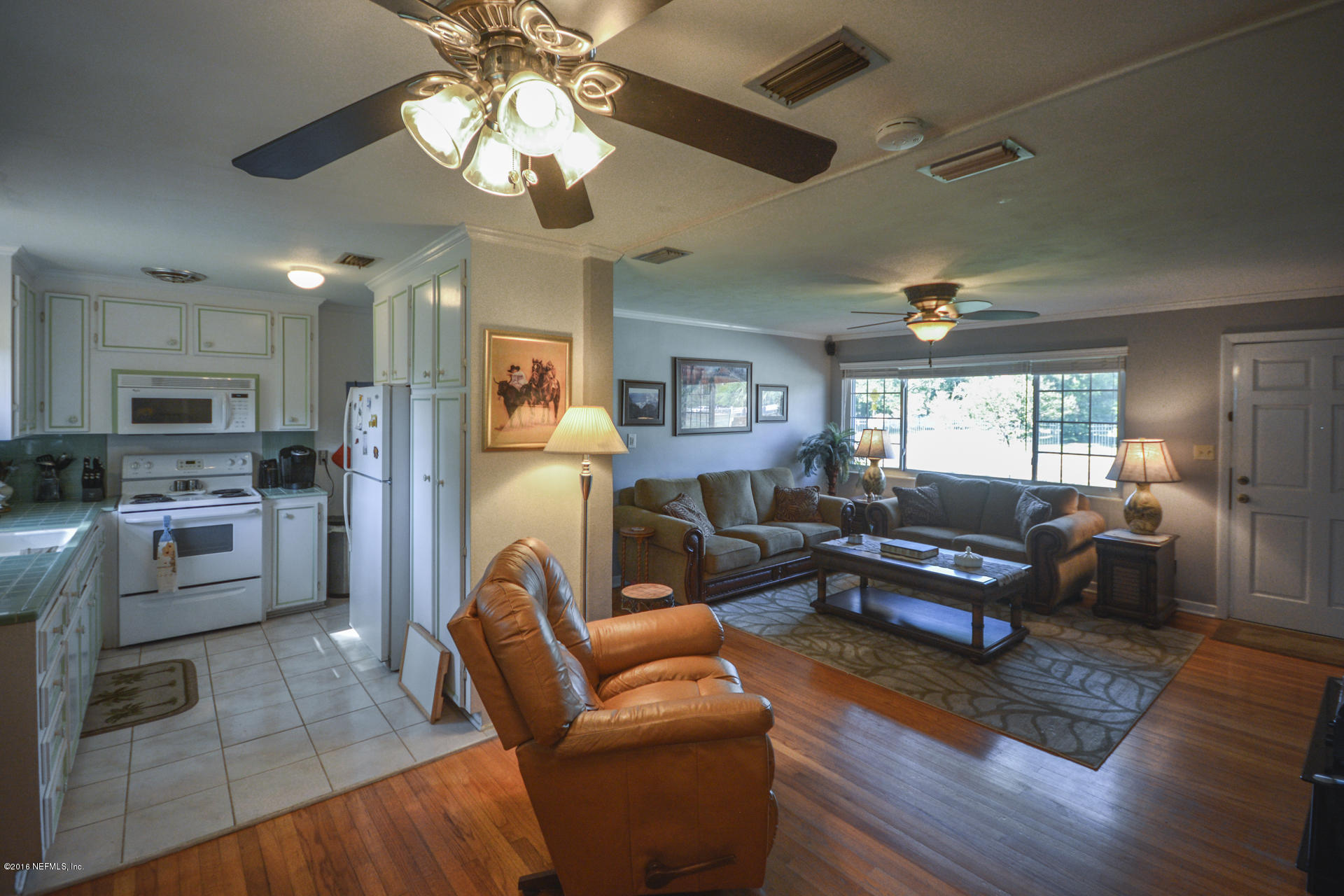 2104 Dean Road Jacksonville, FL 32216 - Photo 8 of 20 a living room with furniture and a wooden floor