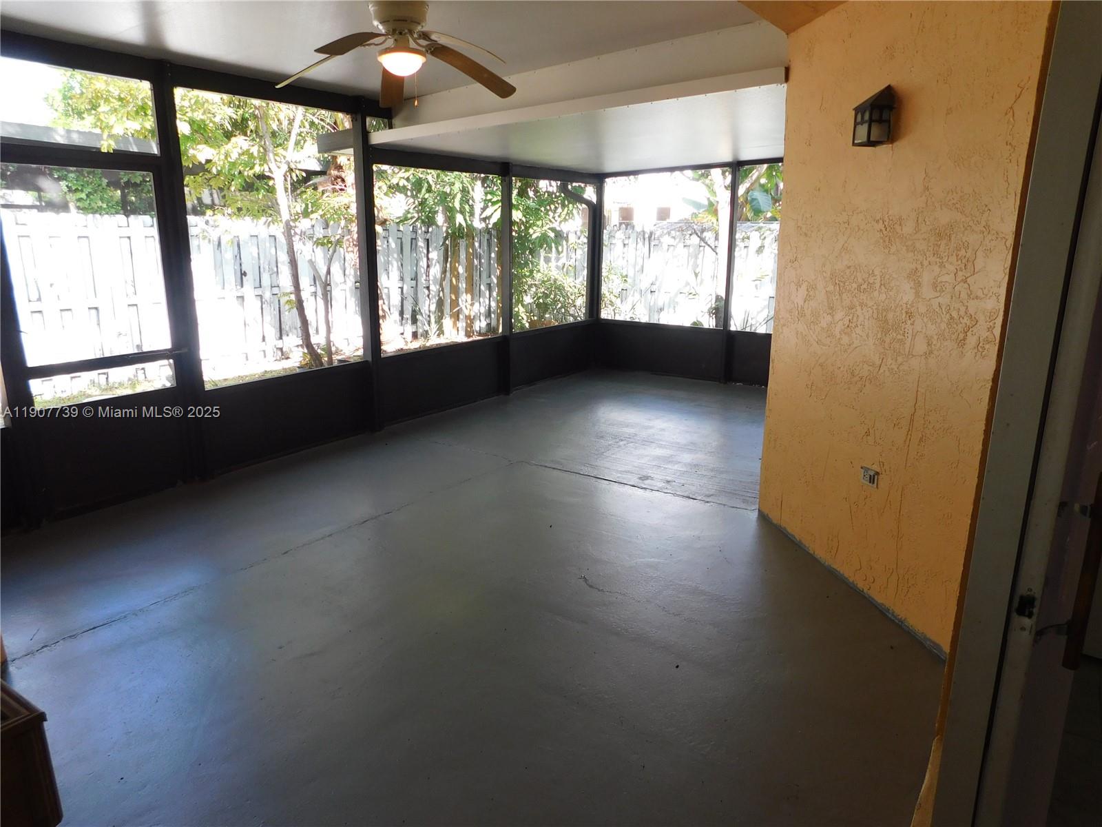 2851 River Run Circle West, Unit 2851 Miramar, FL 33025 - Photo 14 of 33 a view of empty room with wooden floor and fan