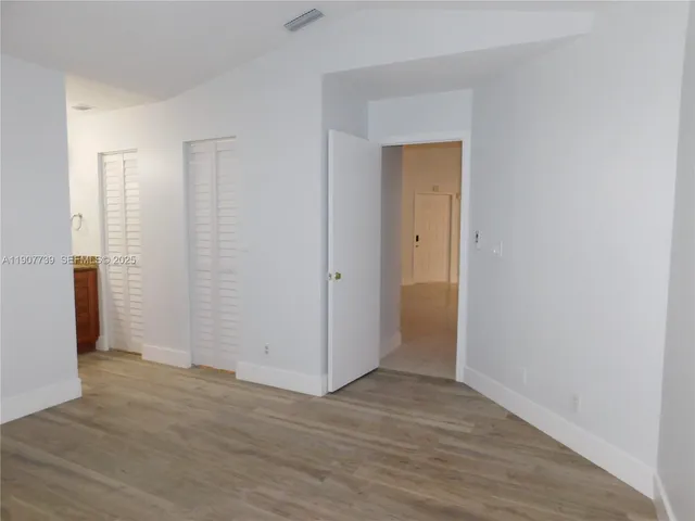 a bathroom with a light fixture and a shower