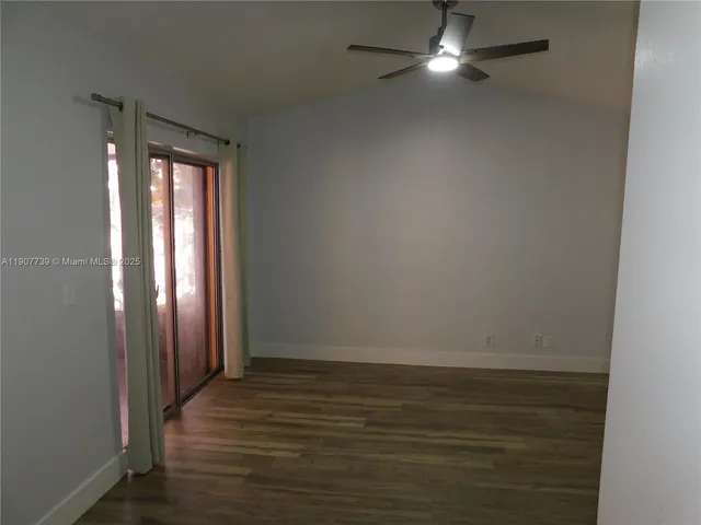 a view of a pathway covered with flower plants