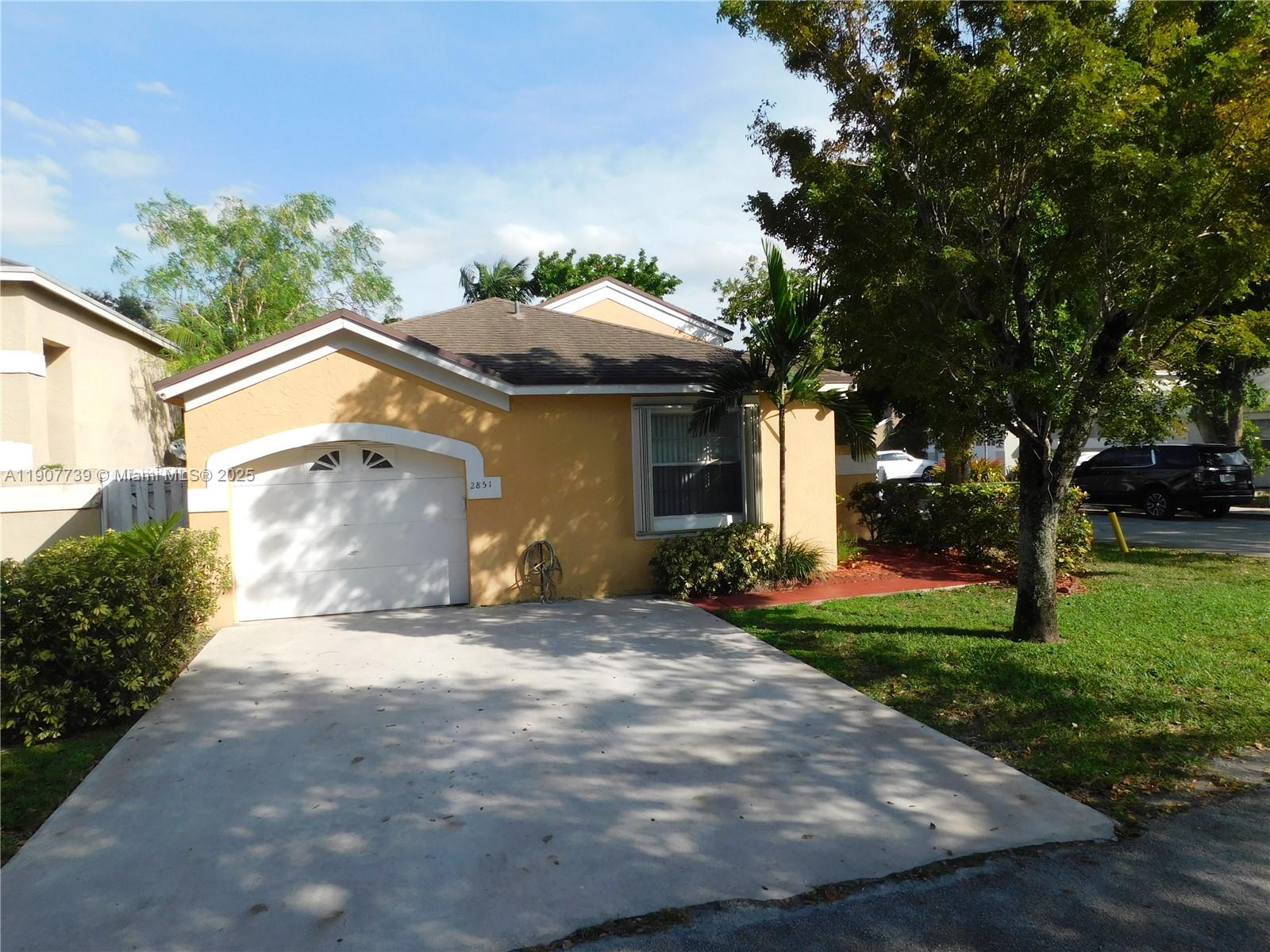 2851 River Run Circle West, Unit 2851 Miramar, FL 33025 - Photo 33 of 33 a view of a house with a yard