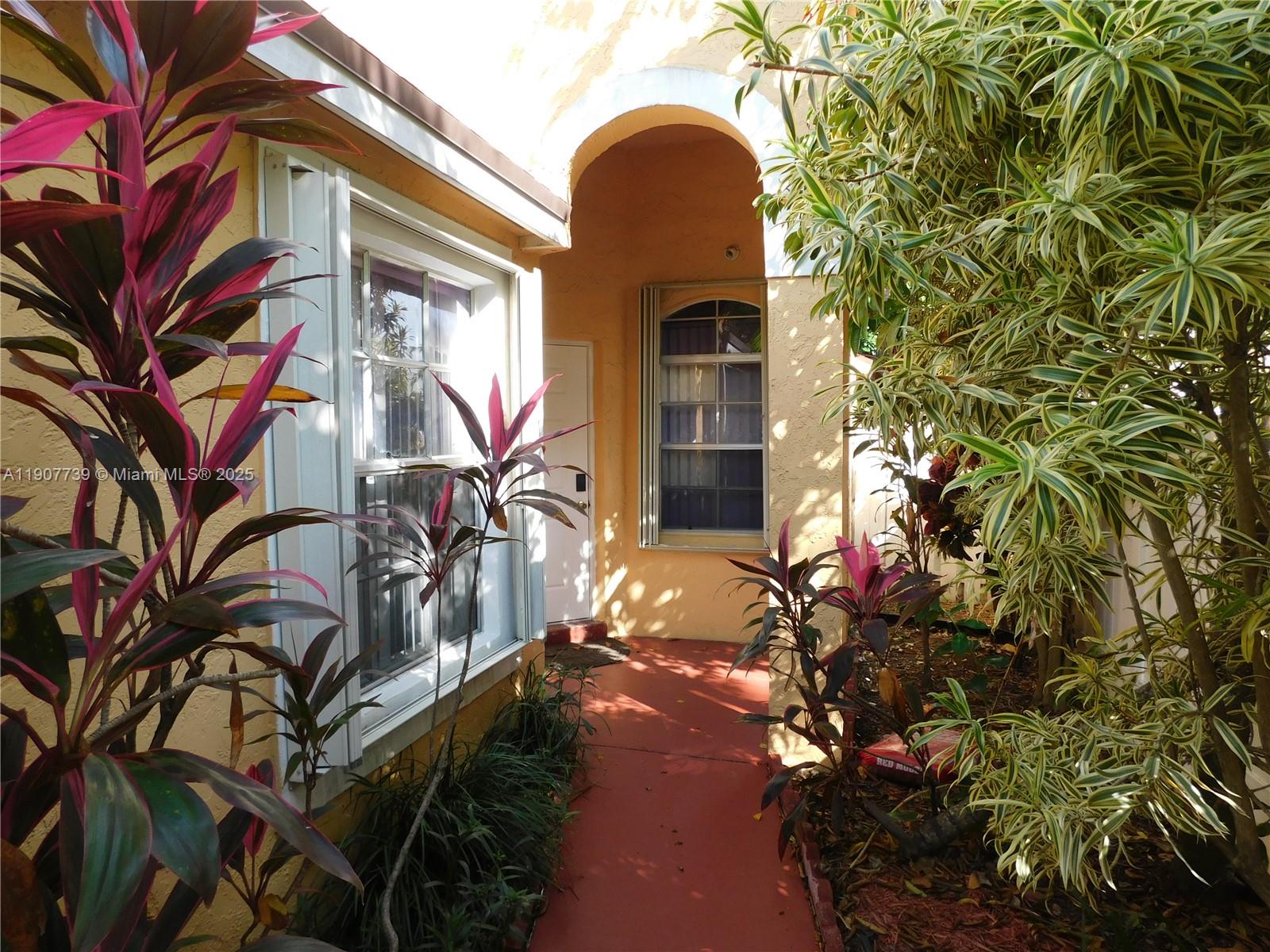 2851 River Run Circle West, Unit 2851 Miramar, FL 33025 - Photo 4 of 33 a view of a house with a tree
