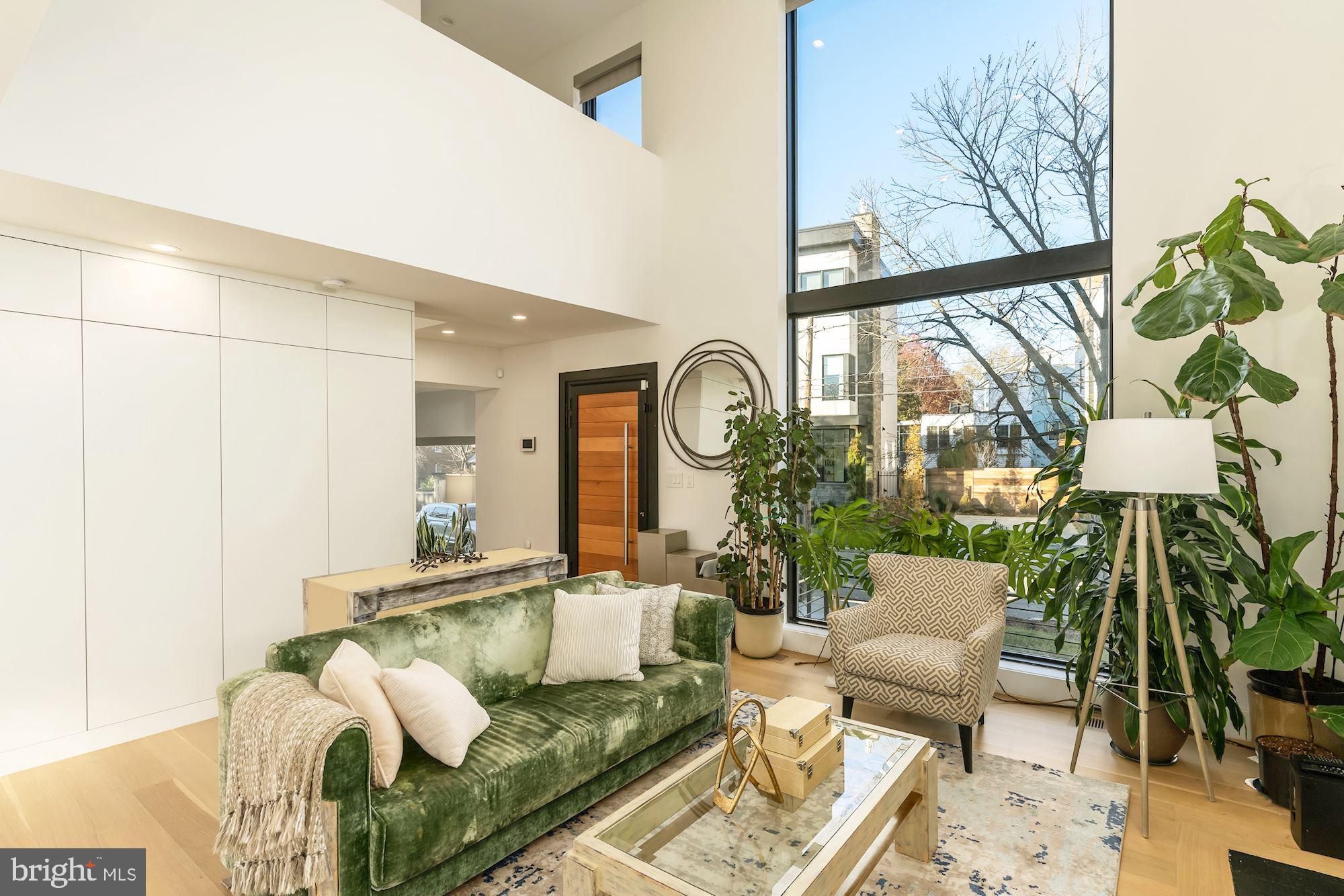 4319 Murdock Mill Road Northwest Washington, DC 20016 - Photo 17 of 49 Living Room with Two-Story Windows
