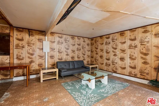 a living room with furniture and a rug