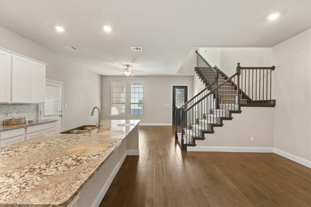 7401 Sunset Boulevard Rowlett, TX 75088 - Photo 18 of 35 a view of entryway and kitchen with wooden floor