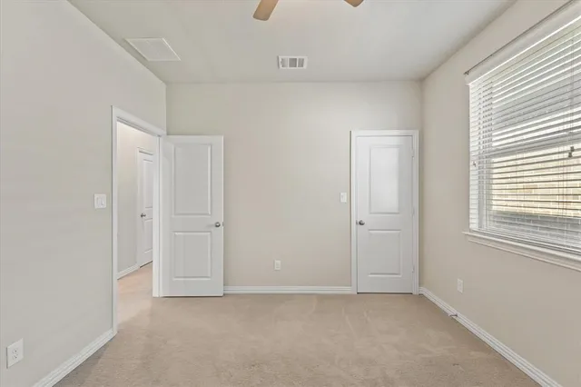 a view of a brick house with a pathway
