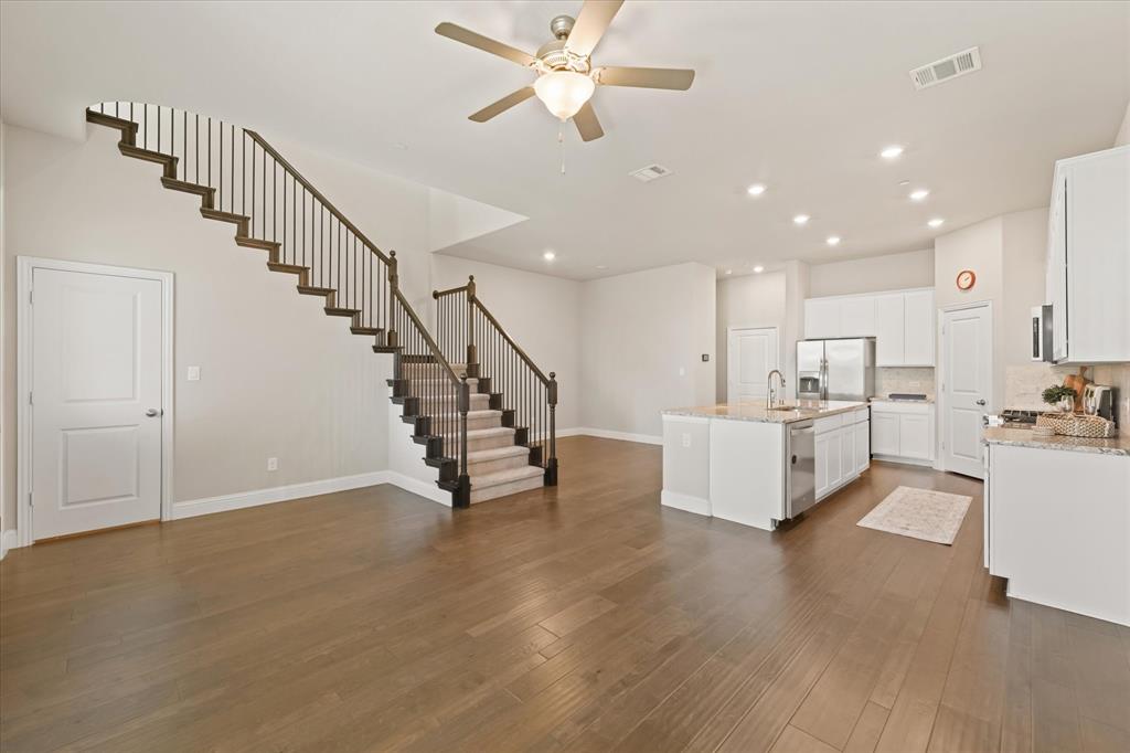 7401 Sunset Boulevard Rowlett, TX 75088 - Photo 7 of 35 a view of kitchen with furniture and a chandelier fan