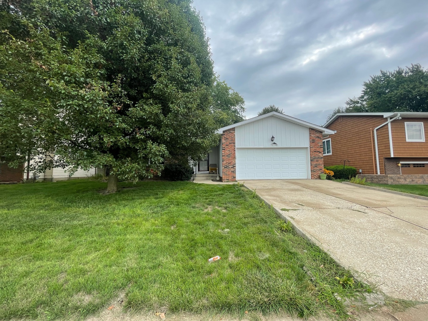 830 South Green Meadow Drive Decatur, IL 62521 - Photo 1 of 26 a front view of a house with garden