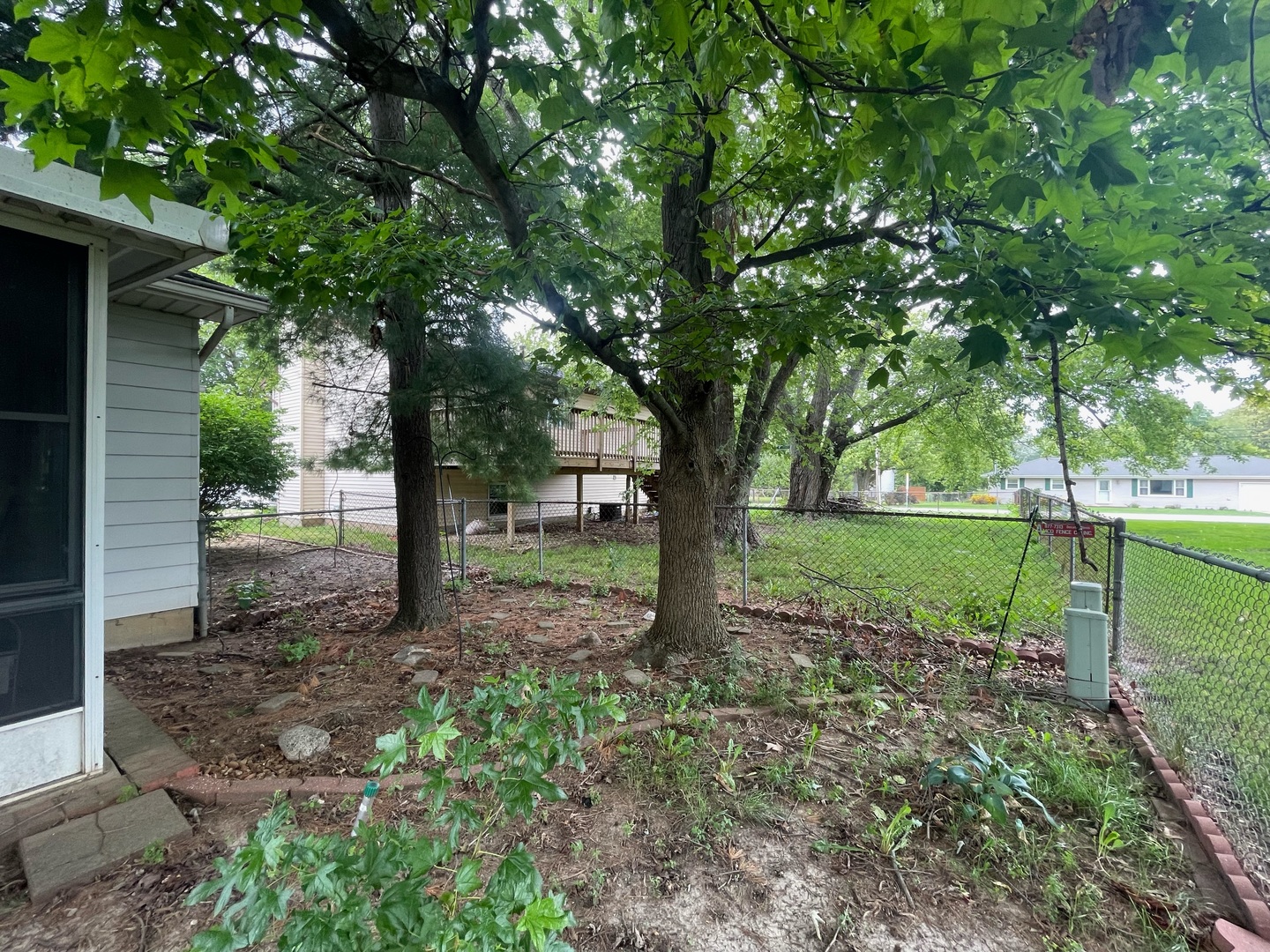 830 South Green Meadow Drive Decatur, IL 62521 - Photo 24 of 26 a view of a garden with a tree